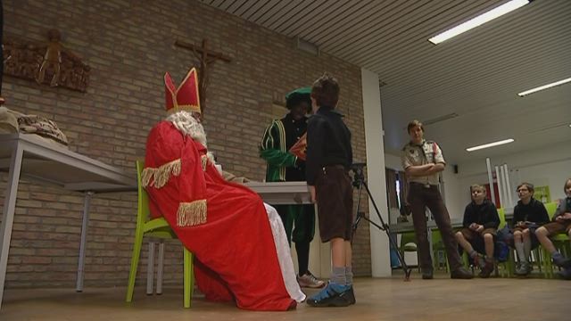 Saint Nicholas and Black Pete visit Belgian children