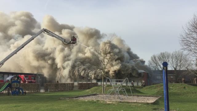 Spectacular fire engulfs former school