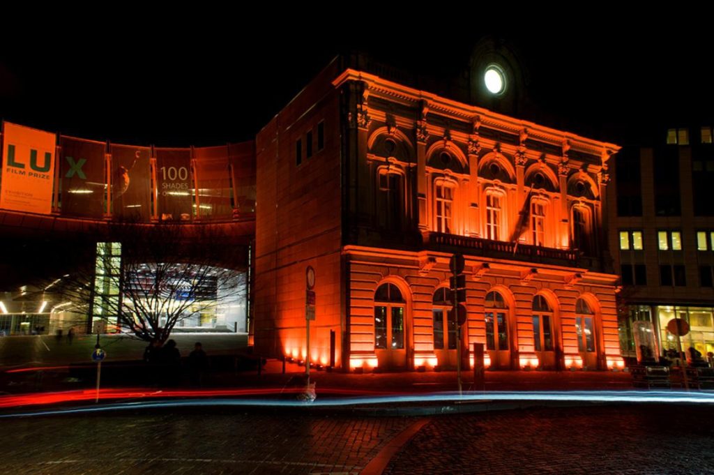 Numerous buildings lit up in orange to protest against violence towards women