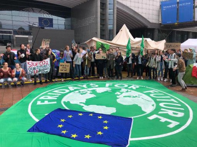 Young climate activists camp out in front of the European Parliament