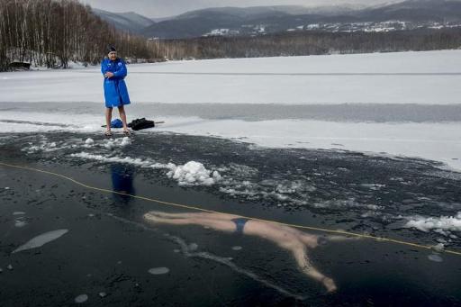 Czech man swims more than 80 metres under ice to enter Guinness World Records