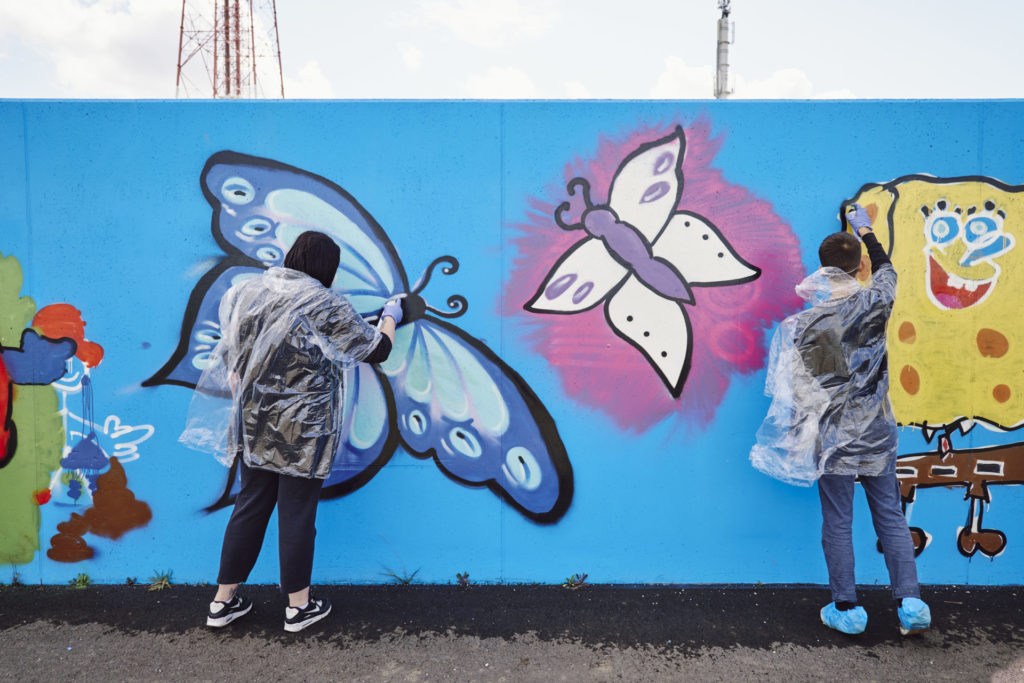 Graffiti workshops transform flood wall in Antwerp port area