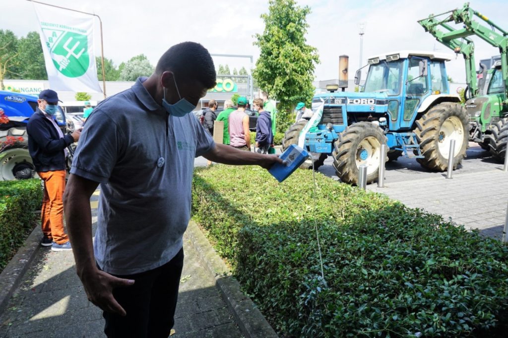 Farmers protest milk prices by bringing tractors to supermarket