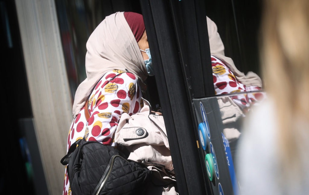 Woman wearing headscarf verbally abused by bus driver