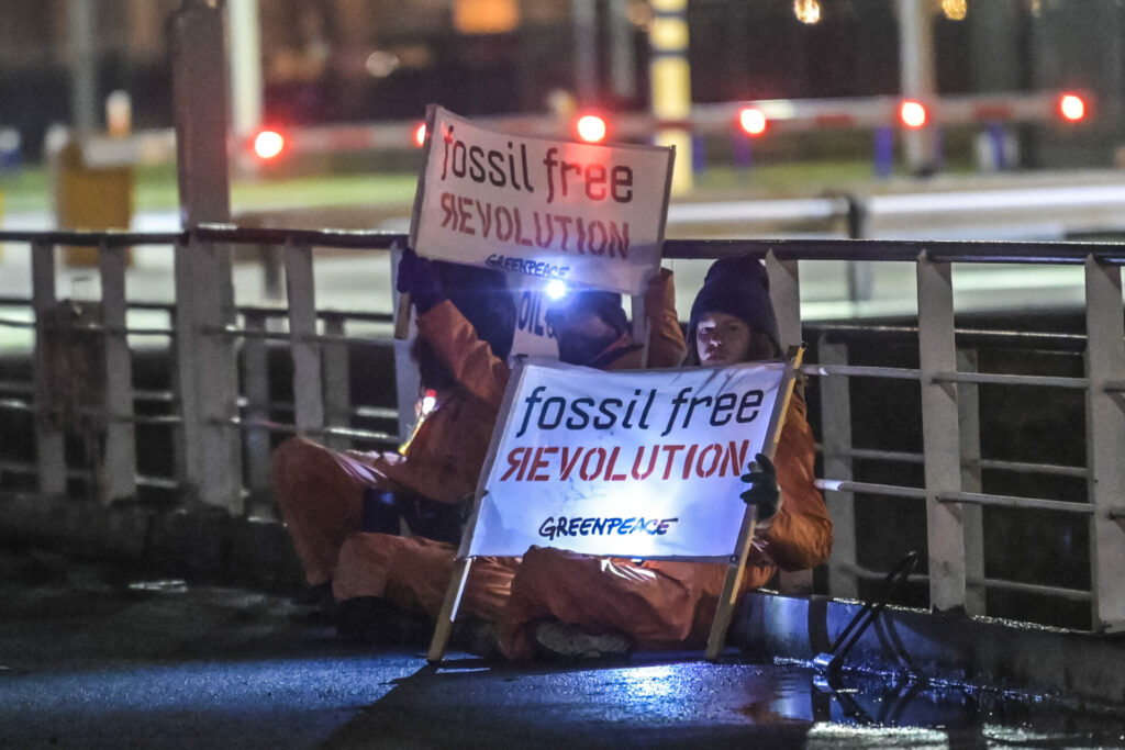 Activists chained to port lock to prevent Russian oil tanker from entering Antwerp harbour