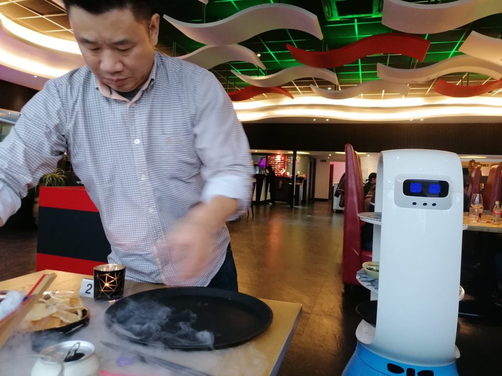 Belgium's robot waiter draws guests from near and far