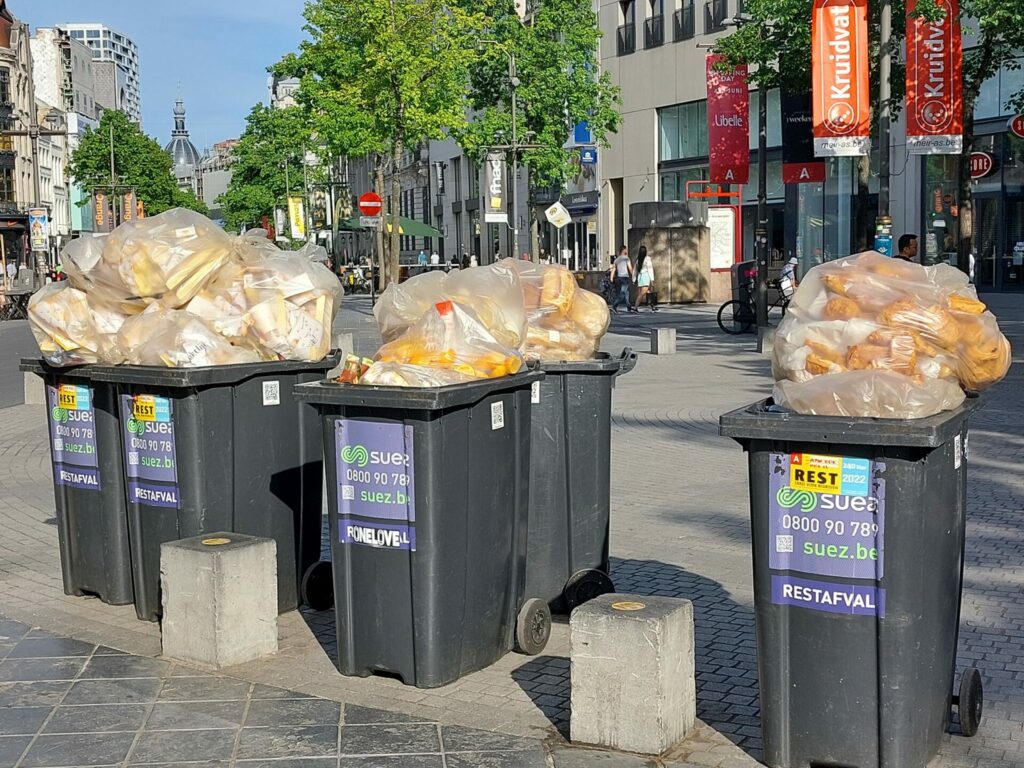 Belgian Panos shop under fire for stuffing bins with bread and pastry
