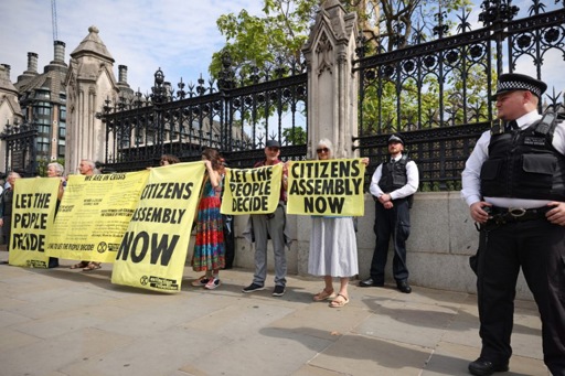 Protesting Extinction Rebellion activists glue themselves to the British House of Commons