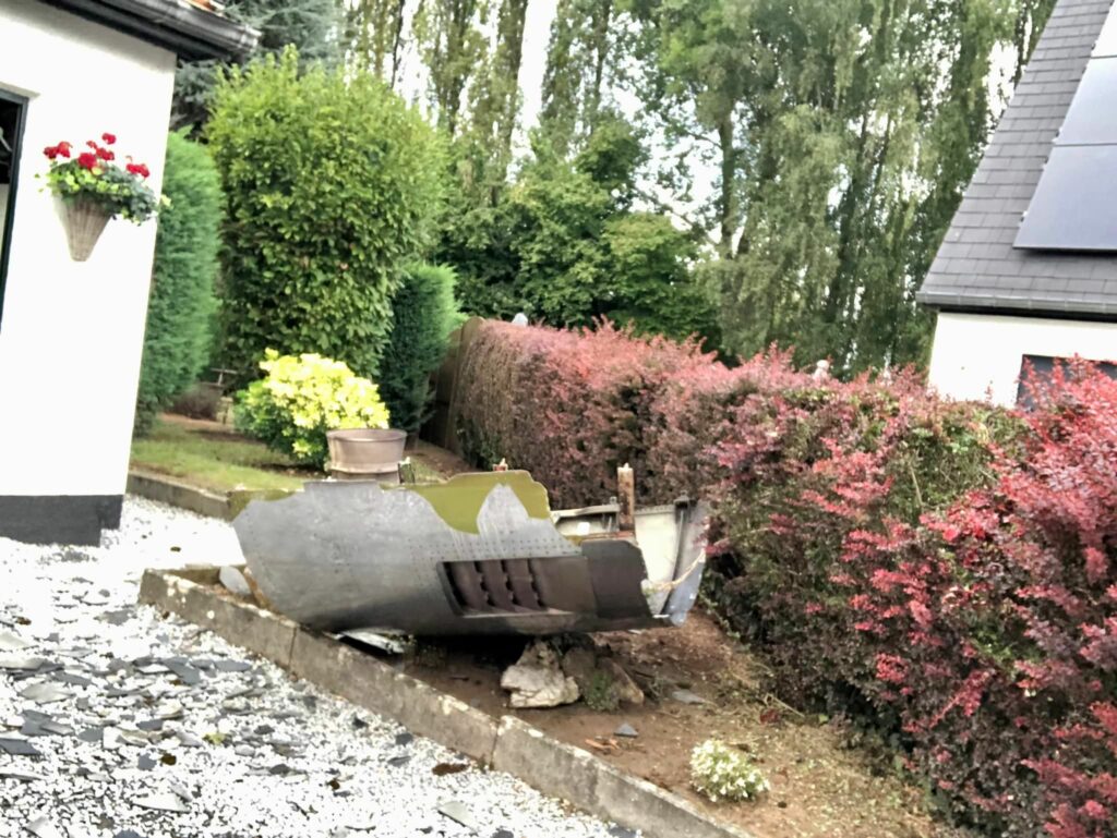 Airplane Engine Falls On House