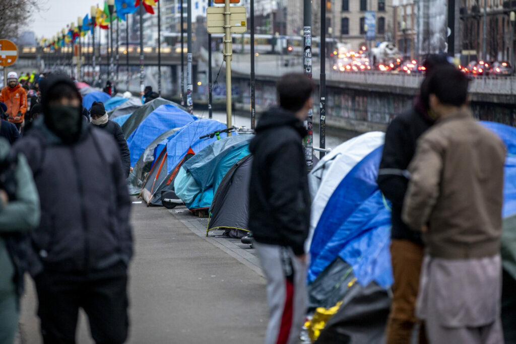 Over 250 asylum seekers sleeping in tents by canal as authorities shift blame
