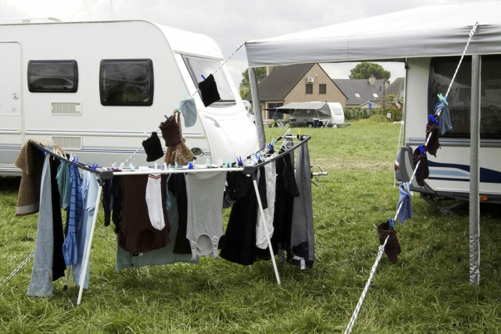 Caravans agree to leave football training ground after days of camping