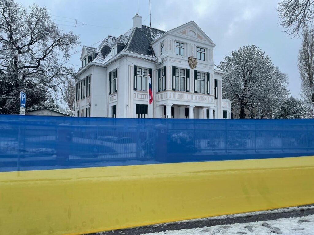 Ukrainian flag protest outside Russian embassy in The Hague reminder about the war