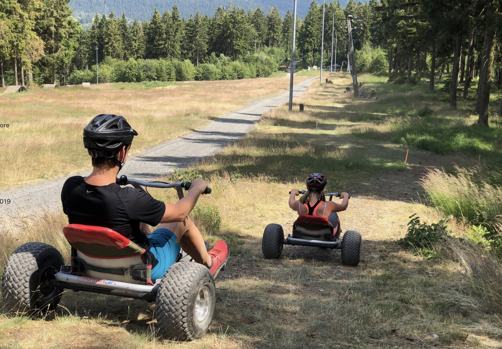 Thrill-seekers take to three-wheelers to descend Belgium's highest peak