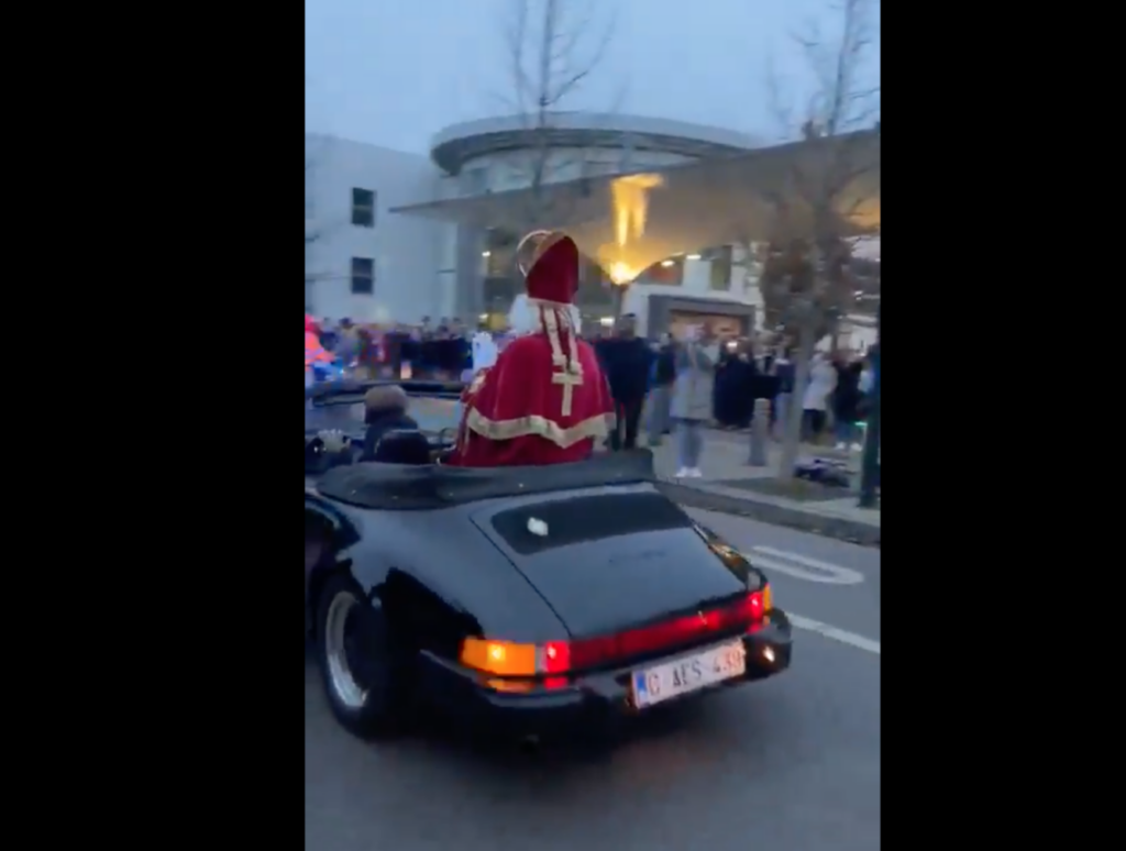 Saint Nicolas arrives at Uccle school in a Porsche