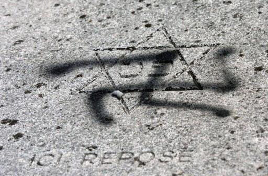Vandals desecrate Jewish cemetery with swastikas