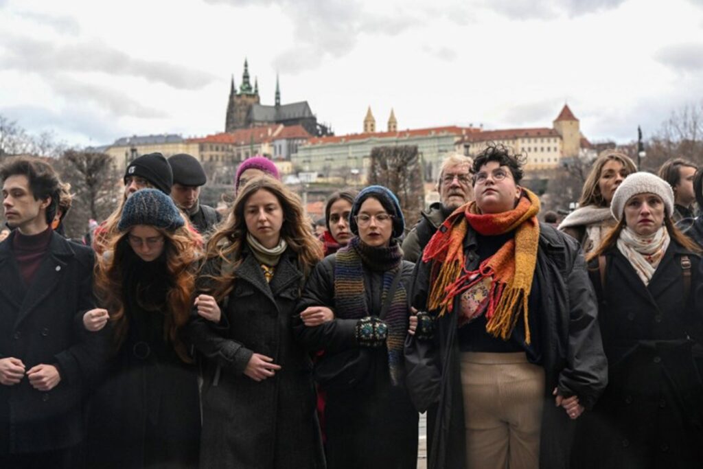 Students march in Prague in memory of shooting victims