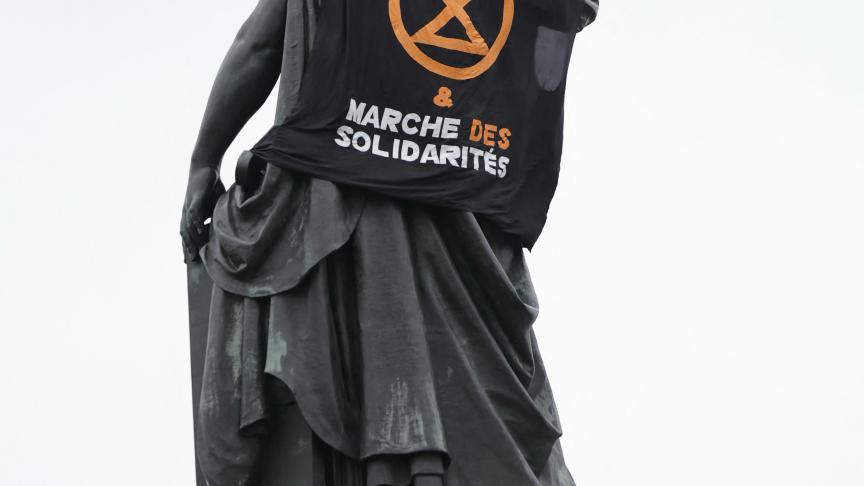 Extinction Rebellion blindfold statues to campaign against fossil fuel subsidies