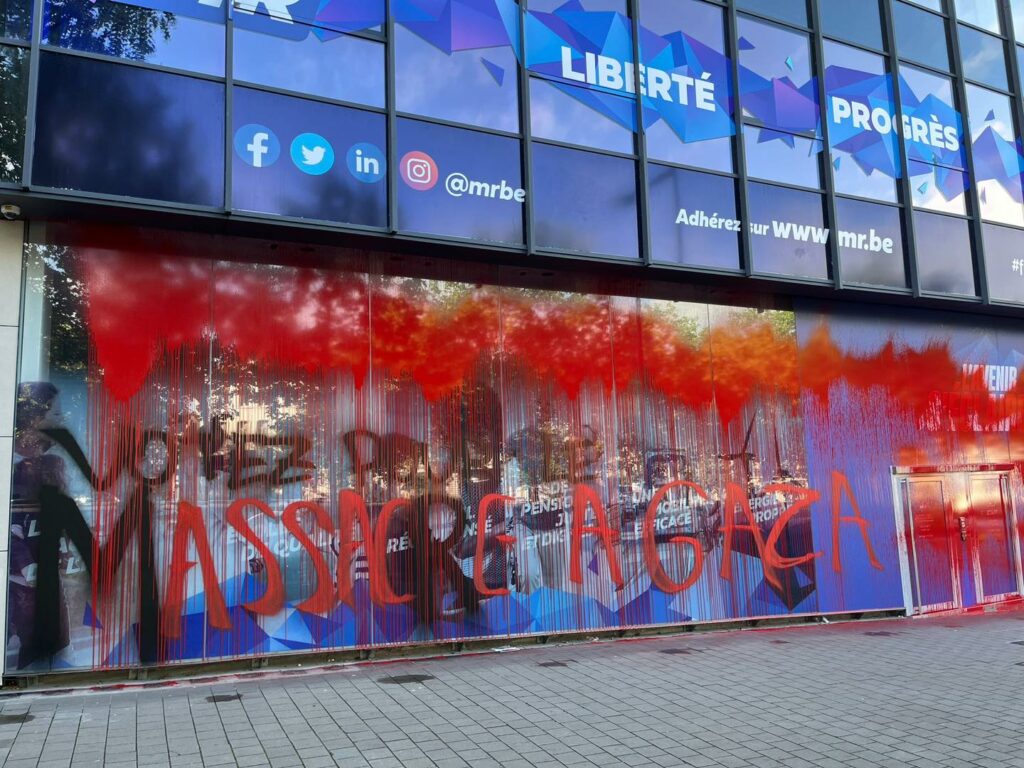 Protesters cover façade of MR headquarters in blood-red paint