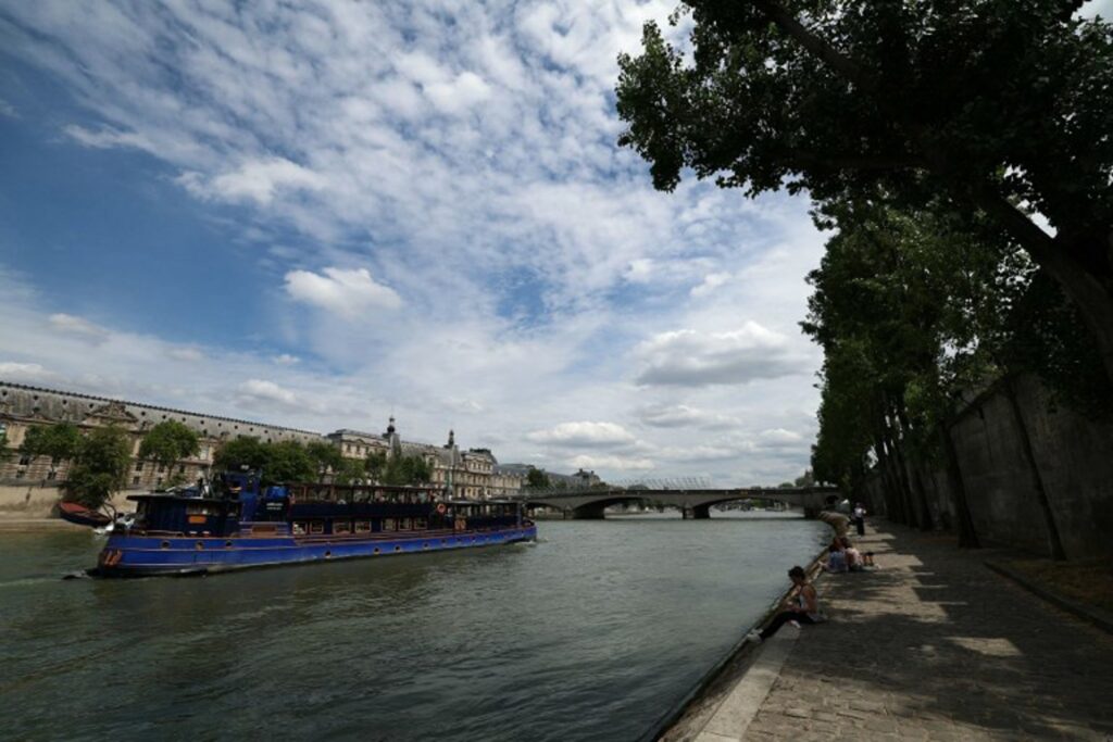 French sports minister swims in Seine ahead of Paris Olympics