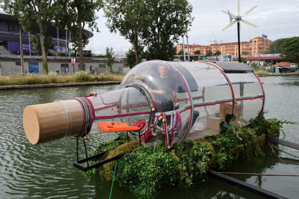 Artist Abraham Poincheval locks himself in a bottle outside the Stade de France