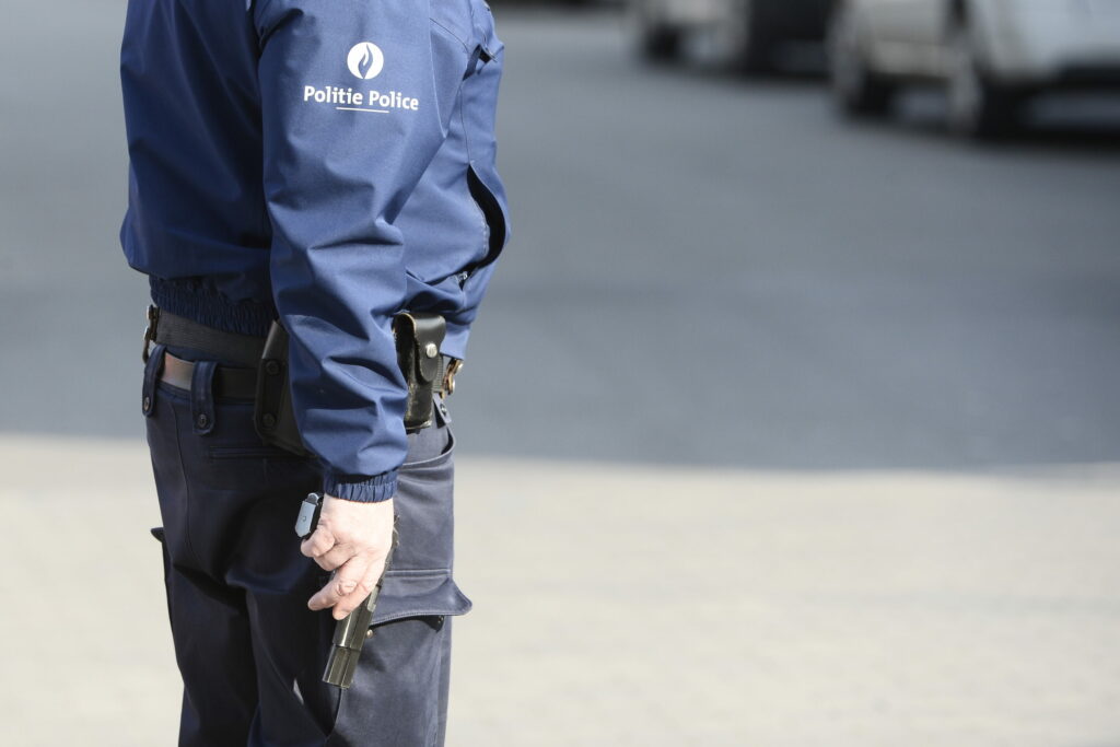 Sacked Brussels police officer arrested in uniform and armed