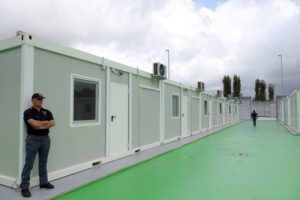 Italian ship carrying first batch of migrants arrives in Albania