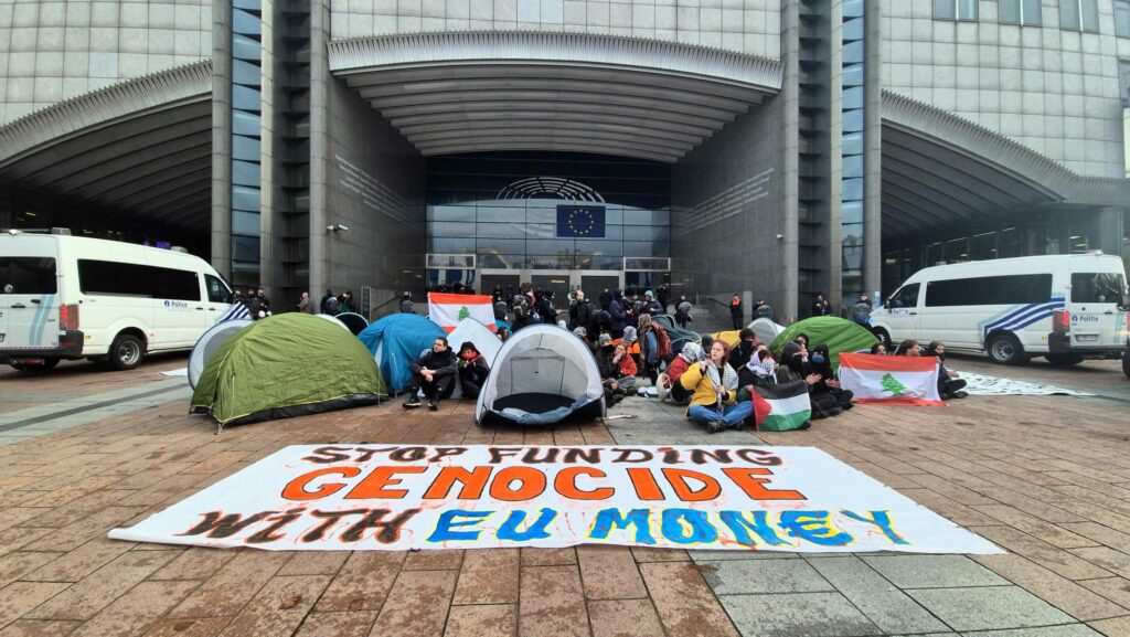 Pro-Palestine protesters gather in front of European Parliament in Brussels