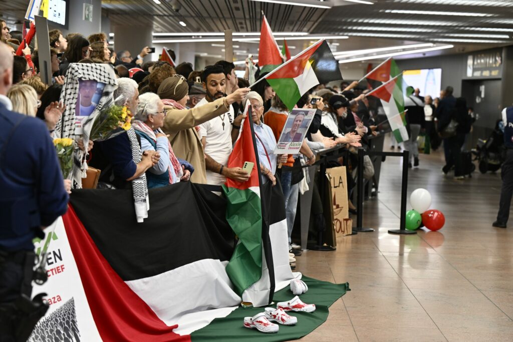 Six activists from Gaza flotilla receive hero's welcome at Brussels Airport
