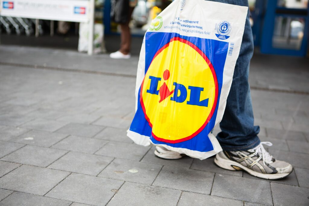 Why is Lidl reluctant to open on Sundays in Belgium?