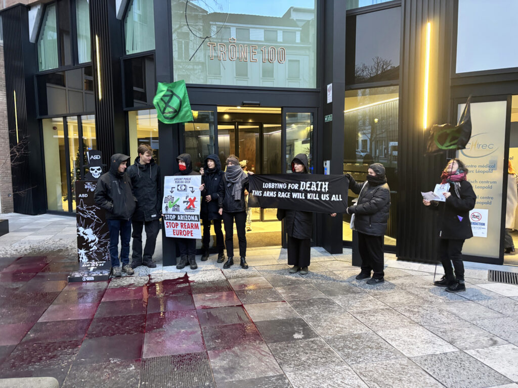 Climate activists take action in Brussels against ReArm Europe