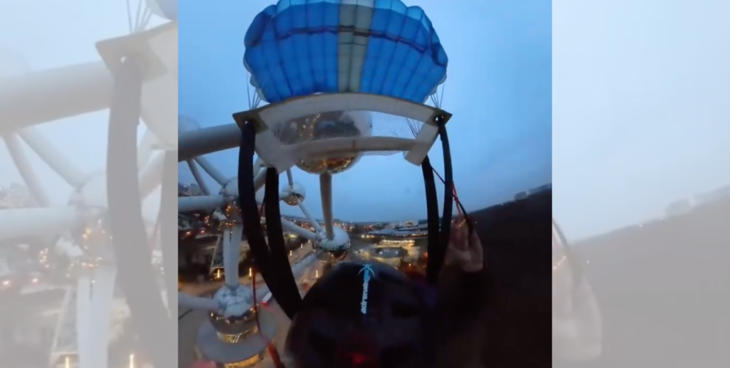 Footage shows two men risk lives in illegal leap from Brussels' most famous monument