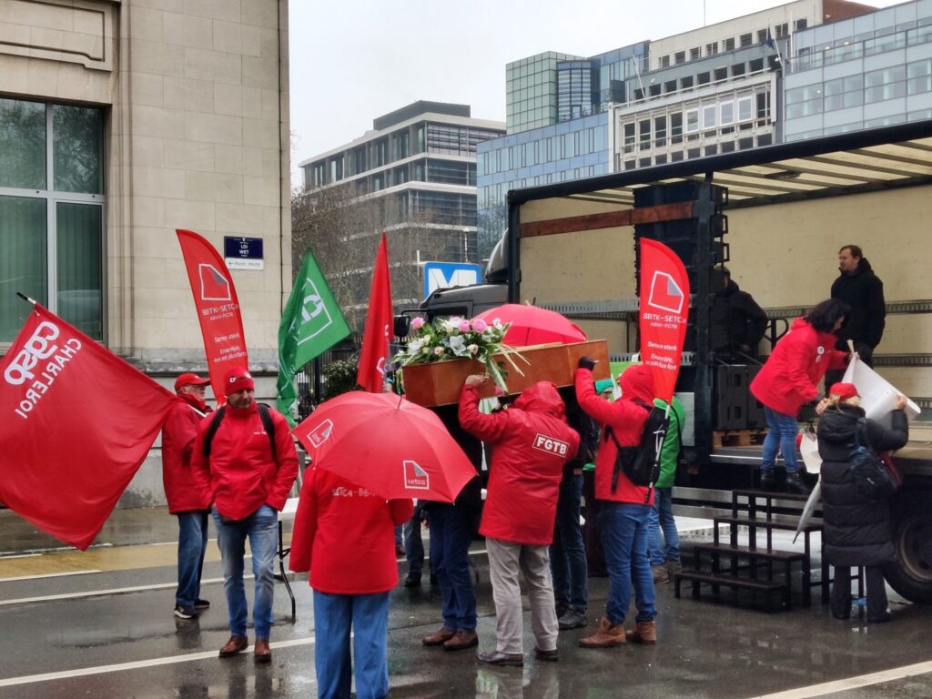 Non-profit sector protests with coffin in Brussels over lack of investment