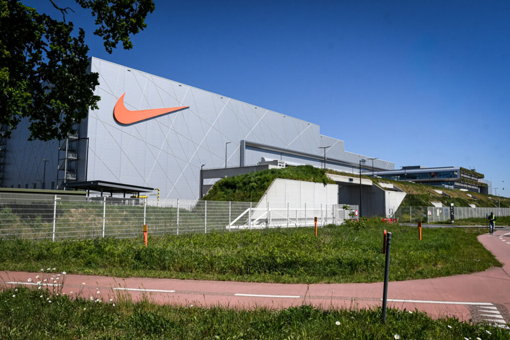 Nike agrees to cut redundancies by half at Belgian centre