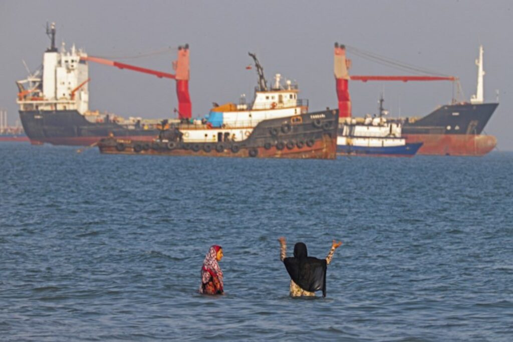 Iran closes Strait of Hormuz, targets two ships after US strikes