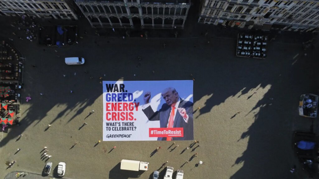 Greenpeace rolls out large anti-Trump banner on Brussels' Grand Place