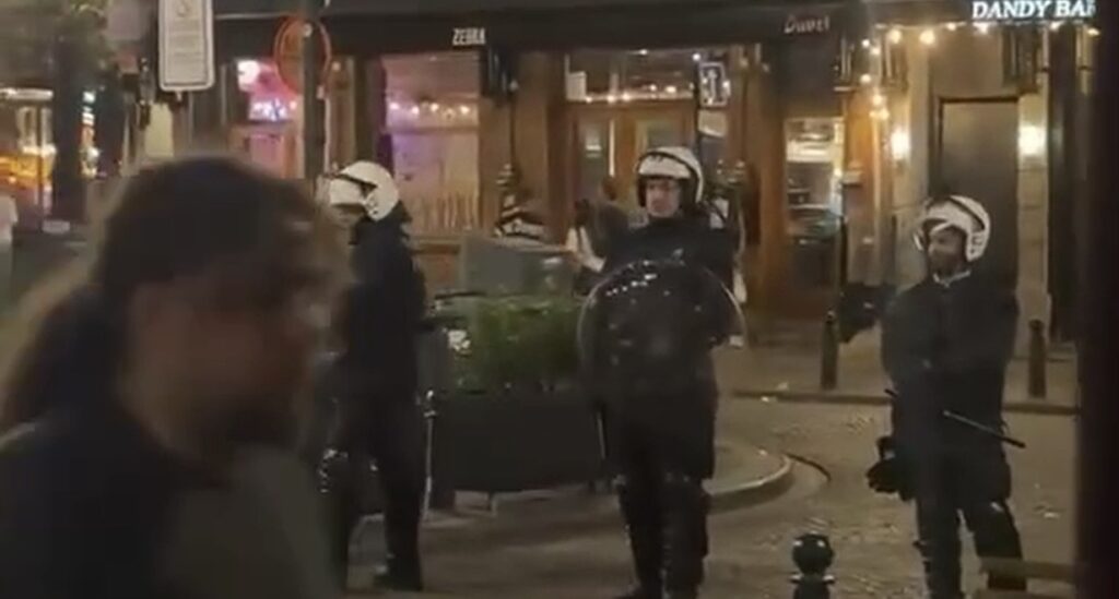 Swedish hooligans fight police in Brussels city centre, three officers injured