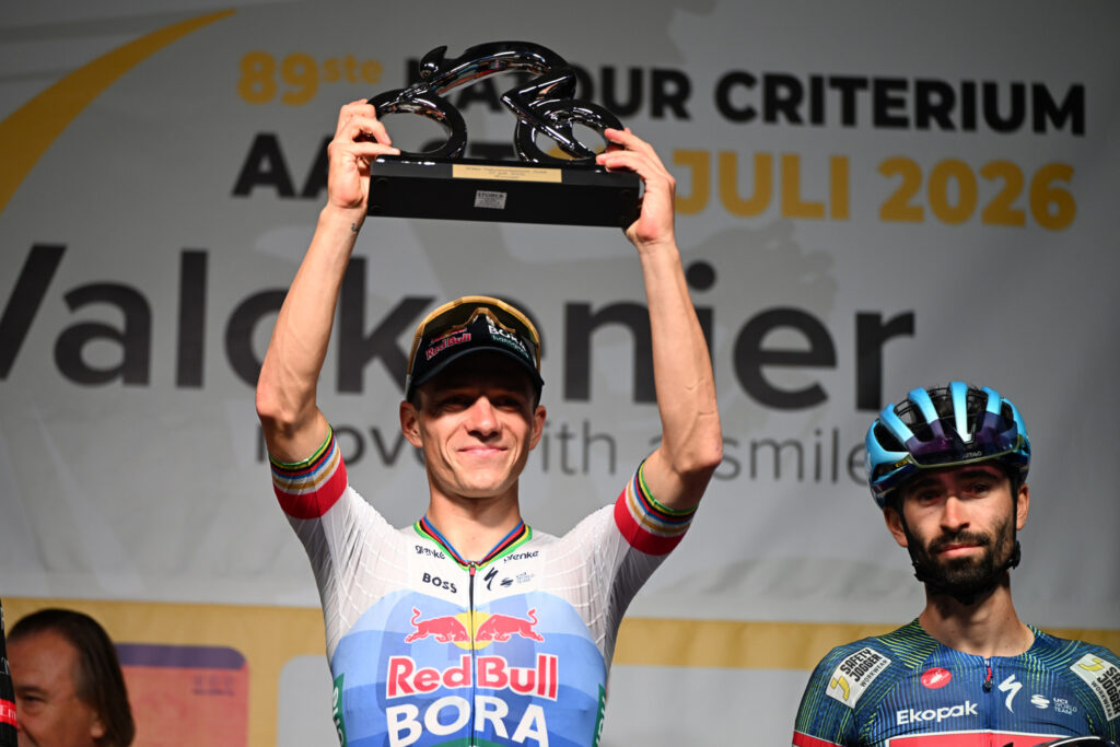 Remco Evenepoel claims the winner's bouquet in his hometown, Aalst